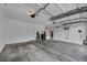 Spacious two car garage featuring an automatic garage door opener and ample space for storage and work at 2124 Rising Mist St, Las Vegas, NV 89134