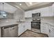Beautiful kitchen with modern stainless steel appliances and white cabinets at 2124 Rising Mist St, Las Vegas, NV 89134
