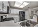 Well-equipped kitchen featuring stainless steel appliances, bright lighting, and sleek countertops at 2124 Rising Mist St, Las Vegas, NV 89134