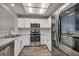 Stylish kitchen featuring stainless steel appliances, white cabinets, and sleek countertops at 2124 Rising Mist St, Las Vegas, NV 89134