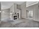 Open-concept living room featuring a fireplace and neutral decor at 2124 Rising Mist St, Las Vegas, NV 89134