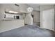 Inviting living room area with a modern light fixture and an opening to the kitchen at 2124 Rising Mist St, Las Vegas, NV 89134