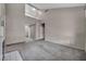 Spacious living room with gray carpeting and neutral wall color at 2124 Rising Mist St, Las Vegas, NV 89134