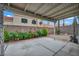 Cozy covered patio with concrete floor, decorative lighting, and garden views at 2124 Rising Mist St, Las Vegas, NV 89134