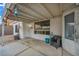 Enclosed patio featuring concrete flooring, a garden view, and a cozy seating area at 2124 Rising Mist St, Las Vegas, NV 89134