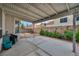 Inviting covered patio with concrete flooring, a small garden and access to an outdoor gravel area at 2124 Rising Mist St, Las Vegas, NV 89134