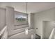 A well-lit stairway with a window offering views of the mountains at 2124 Rising Mist St, Las Vegas, NV 89134