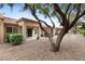 Private backyard features a covered patio and low-maintenance desert landscaping at 2231 Hallston St, Las Vegas, NV 89134