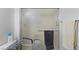 Bathroom featuring glass-door shower and towel bars, ample space for accessibility at 2231 Hallston St, Las Vegas, NV 89134