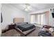Bedroom with carpet, ceiling fan, neutral color palette, and natural light at 2231 Hallston St, Las Vegas, NV 89134