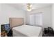 Cozy bedroom with neutral walls, a ceiling fan, and natural light from the window at 2231 Hallston St, Las Vegas, NV 89134