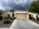 Single-story home featuring a two-car garage and a neutral color palette at 2231 Hallston St, Las Vegas, NV 89134