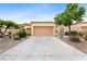 Charming single-story home with a well-maintained front yard and two-car garage at 2231 Hallston St, Las Vegas, NV 89134