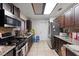 Featuring stainless steel appliances and dark wood cabinets and granite countertops at 2231 Hallston St, Las Vegas, NV 89134