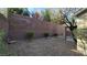 A fully fenced backyard provides privacy with a low maintenance xeriscape landscape at 2737 Rimbaud St, Henderson, NV 89044