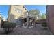 Backyard with gravel, covered patio, and privacy wall at 2737 Rimbaud St, Henderson, NV 89044