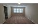 This spacious bedroom has neutral walls, carpet, and shutter blinds for natural light control at 2737 Rimbaud St, Henderson, NV 89044