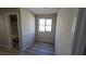 This bedroom has neutral walls, vinyl floors, and a window with a view to the backyard at 2737 Rimbaud St, Henderson, NV 89044