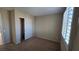 This bedroom has neutral walls, carpet, and a closet with sliding doors and shutter blinds at 2737 Rimbaud St, Henderson, NV 89044