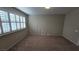 This spacious bedroom has neutral walls, carpet, and shutter blinds for natural light control at 2737 Rimbaud St, Henderson, NV 89044