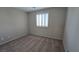 This bedroom features neutral walls, carpet, and natural light from the window with shutter blinds at 2737 Rimbaud St, Henderson, NV 89044