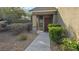 Inviting front entrance with a covered porch, manicured bushes, and a well-lit walkway to the front door at 2737 Rimbaud St, Henderson, NV 89044
