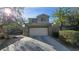 Charming two-story home featuring a two-car garage and inviting curb appeal with mature landscaping at 2737 Rimbaud St, Henderson, NV 89044