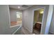 Upstairs hallway provides access to the bathroom and bedrooms with neutral color walls at 2737 Rimbaud St, Henderson, NV 89044