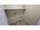 Functional laundry room with shelving and utility connections at 2737 Rimbaud St, Henderson, NV 89044