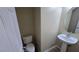 Half bathroom features a pedestal sink and white fixtures at 2737 Rimbaud St, Henderson, NV 89044