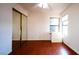 Bedroom featuring dark floors, closet and window at 3217 Symphony Dr, Las Vegas, NV 89146