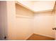 Walk in closet with rods and carpet at 3217 Symphony Dr, Las Vegas, NV 89146