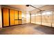 Spacious garage with built-in storage cabinets and shelving for organized parking and projects at 3217 Symphony Dr, Las Vegas, NV 89146