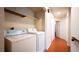 Convenient laundry area with washer, dryer, and storage shelves near the hallway at 3217 Symphony Dr, Las Vegas, NV 89146