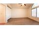 A main bedroom featuring vaulted ceilings, large windows, and built-in storage at 3217 Symphony Dr, Las Vegas, NV 89146