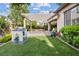 Landscaped backyard with artificial turf, playhouse and patio at 3218 Mura Del Prato Ave, Henderson, NV 89044