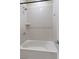 Clean, white bathtub with showerhead, small shelf, and chrome fixtures at 3218 Mura Del Prato Ave, Henderson, NV 89044
