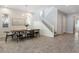 Spacious dining area featuring tile flooring and stairs leading to the second story of the home at 3218 Mura Del Prato Ave, Henderson, NV 89044