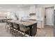 Updated kitchen featuring an island with bar stools, stainless steel appliances, and white cabinets at 3218 Mura Del Prato Ave, Henderson, NV 89044