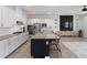 Modern kitchen with island seating, stainless appliances, and open layout to living area at 3218 Mura Del Prato Ave, Henderson, NV 89044