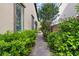 Side yard walkway featuring pavers and lush landscaping at 3218 Mura Del Prato Ave, Henderson, NV 89044