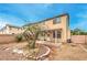 Exterior view of house featuring spacious backyard with covered patio at 3448 Quiet Pueblo St, North Las Vegas, NV 89032
