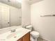 Bright half bath features white sink and toilet at 3448 Quiet Pueblo St, North Las Vegas, NV 89032