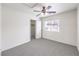 Bright bedroom with a ceiling fan, window, and a closet with an open door at 3448 Quiet Pueblo St, North Las Vegas, NV 89032