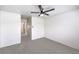 Bright bedroom featuring a ceiling fan, neutral paint, and carpet floors at 3448 Quiet Pueblo St, North Las Vegas, NV 89032
