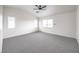 Large primary bedroom with three windows and carpet at 3448 Quiet Pueblo St, North Las Vegas, NV 89032