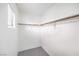 Walk-in closet with wood shelving and carpet at 3448 Quiet Pueblo St, North Las Vegas, NV 89032