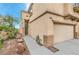 Exterior of two-story house with attached garage and desert landscaping at 3448 Quiet Pueblo St, North Las Vegas, NV 89032