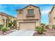 Two-story house featuring a two-car garage and beautiful landscaping at 3448 Quiet Pueblo St, North Las Vegas, NV 89032