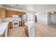 Bright kitchen features tile flooring, white counters, and stainless steel refrigerator at 3448 Quiet Pueblo St, North Las Vegas, NV 89032